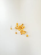 A handful of gold locking pin backs