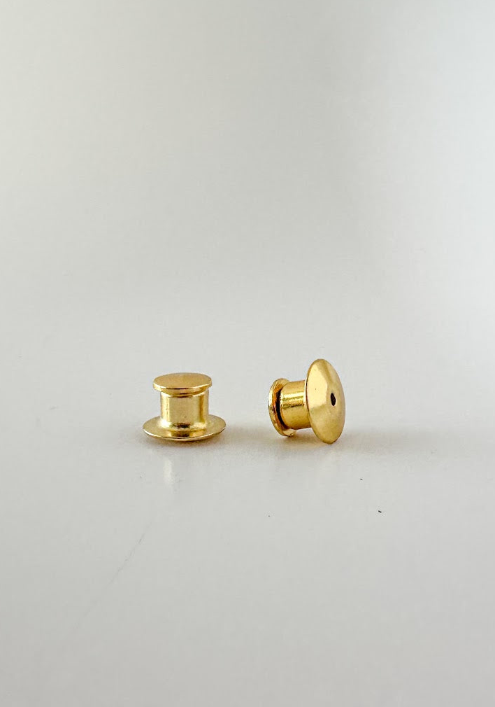 Two gold locking pin backs