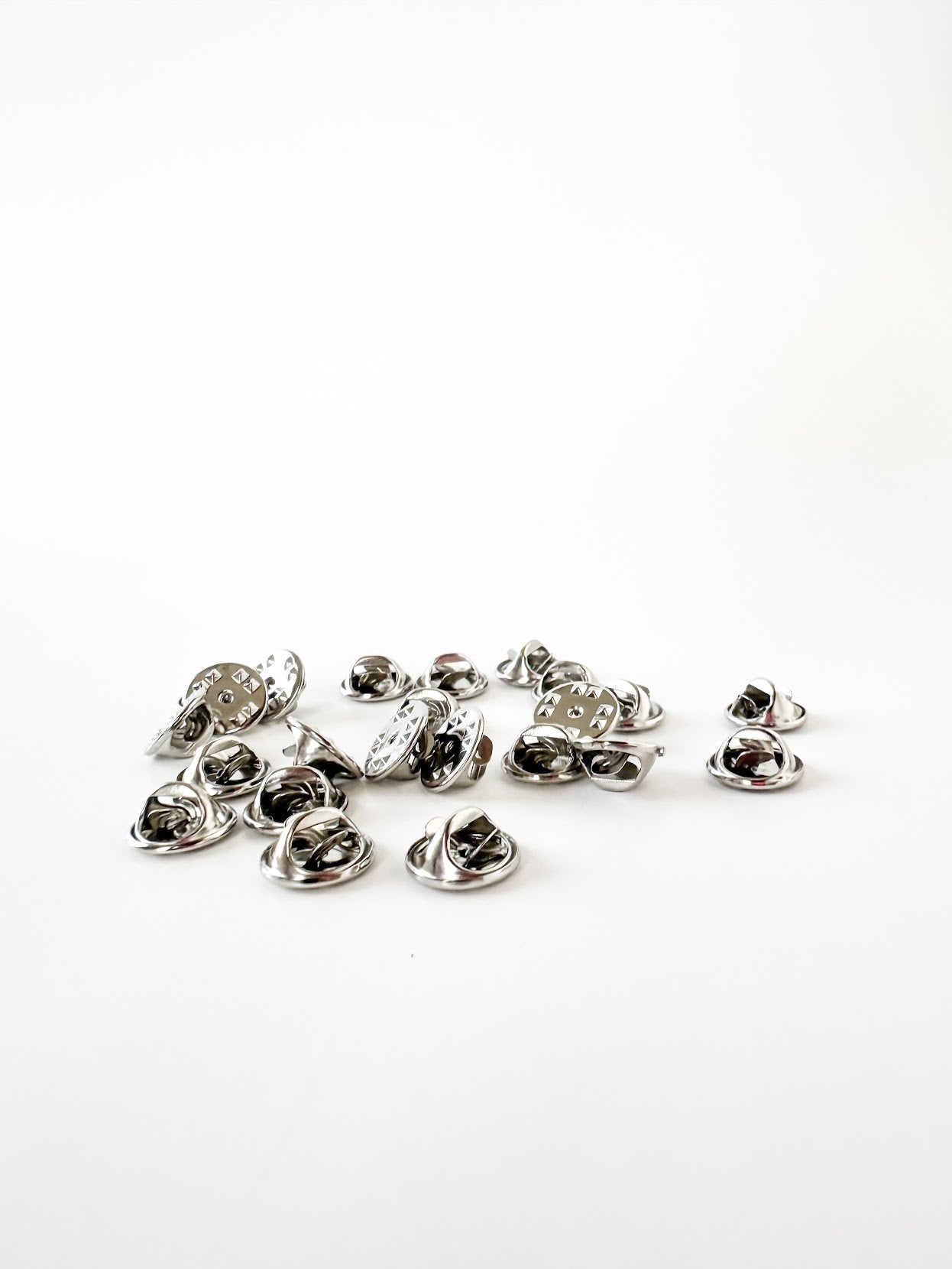 Group of silver military clutch pin backs