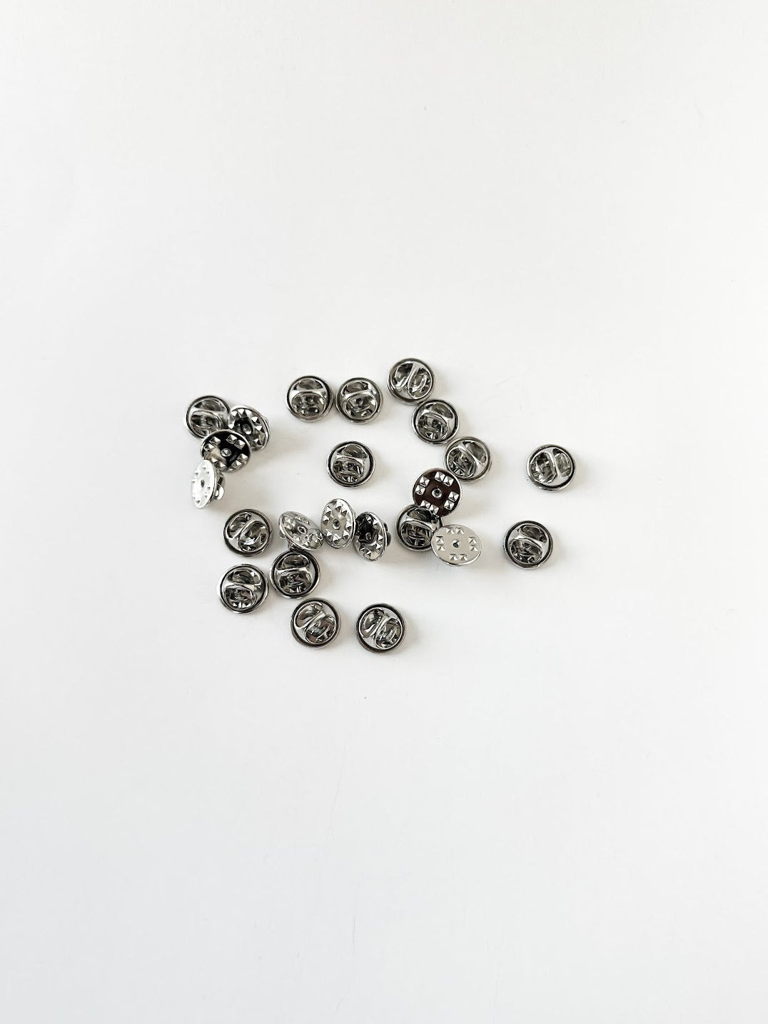 Group of silver military clutch pin backs