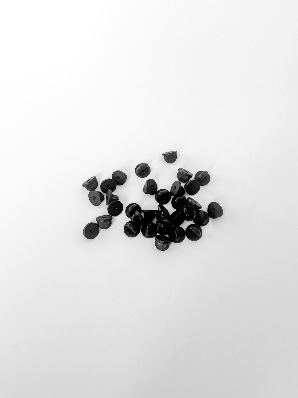 A group of PVC black rubber pin backs